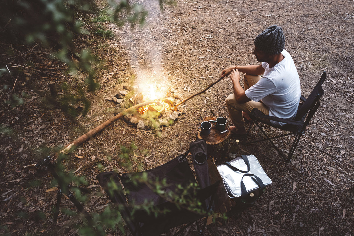 Adventurers gathered around a campfire in the field