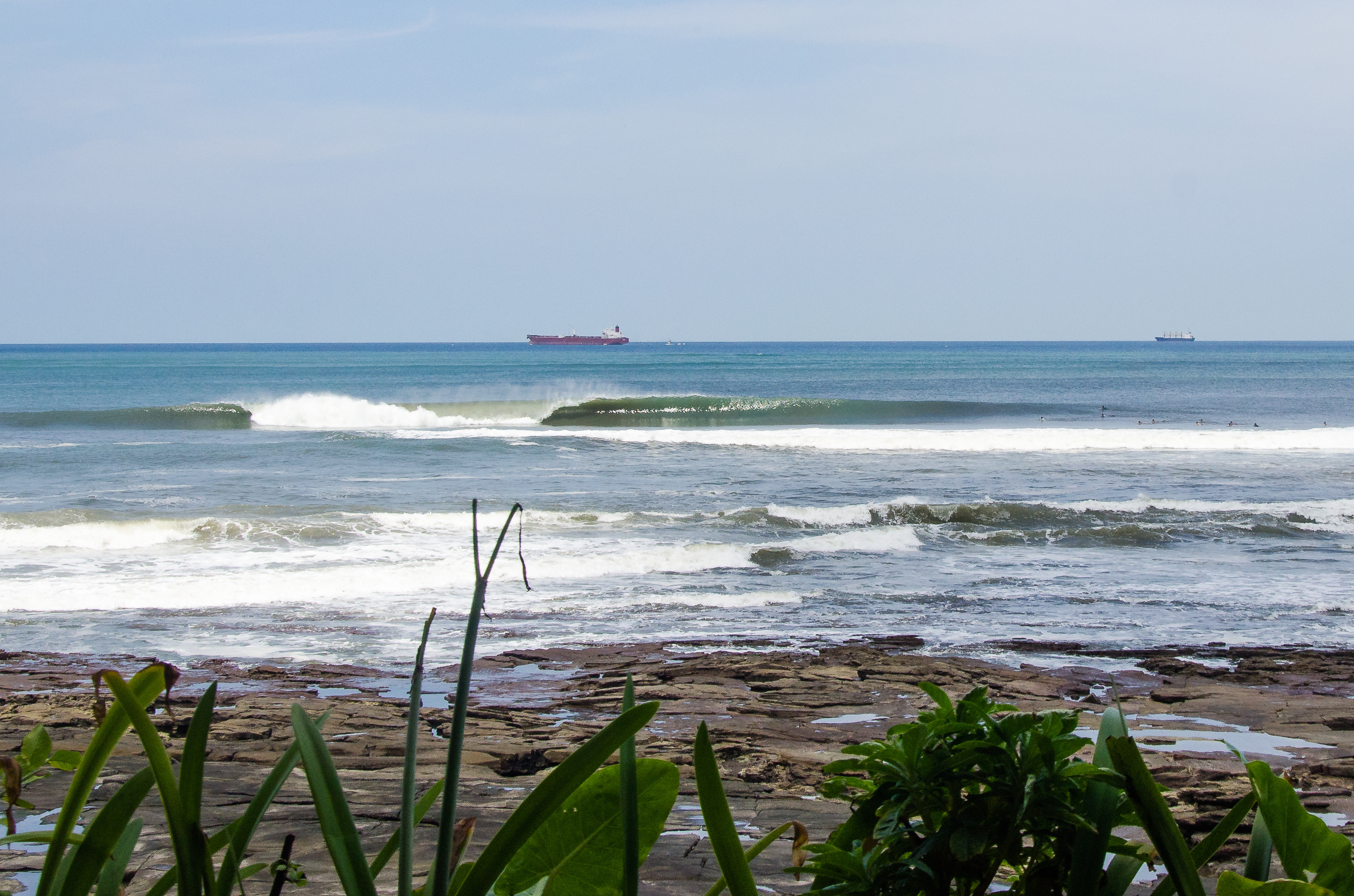 Calm turquoise water at a tropical beach — the kind of still warm surface that makes reading the water easy and dangerous in an entirely different way
