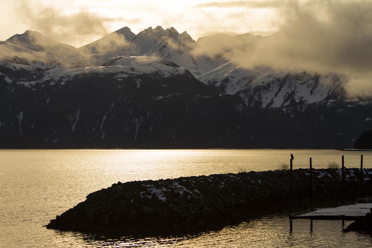 Vast mountain landscape with boreal forest and tundra stretching to the horizon — the same scale of wilderness that makes the W Circuit feel genuinely remote despite its popularity