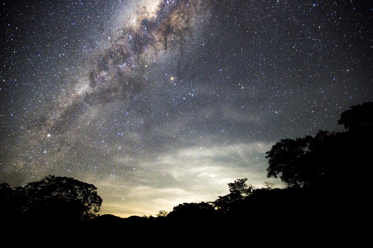 The Milky Way blazing over dark still water — on the one clear night in nine, the Torres del Paine sky is one of the most extraordinary things a person can witness from inside a sleeping bag
